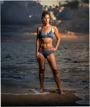 Woman on beach at sunset